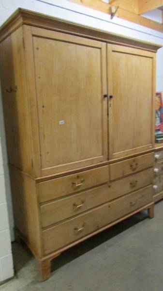 A large old pine linen press.