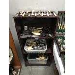 A large quantity of serving cutlery, knives, forks,