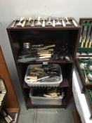 A large quantity of serving cutlery, knives, forks,