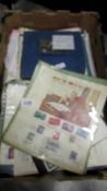 A box of United Nations stamps, commemorative covers, ephemera etc.