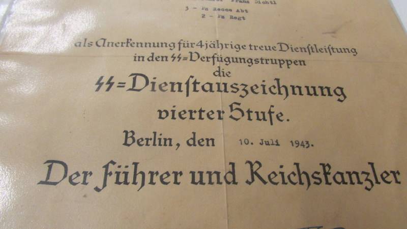 A original WW2 German award document being an SS long service awarded for SS Scharfuhrer Franz - Image 3 of 4