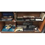 A good selection of cased/boxed cutlery sets (2 shelves)