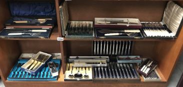 A good selection of cased/boxed cutlery sets (2 shelves)