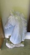 A large marble horse head statue.