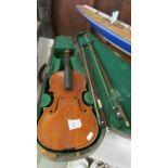 An old violin in wooden case, a/f.