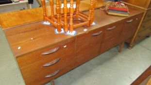 A retro teak sideboard with 3 drawers including cutlery drawer, some scratches to top.