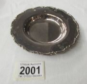 A hall marked silver dish, 12.5 cm diameter.