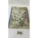 A Japanese album of Japanese stamps and postcards.