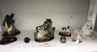 5 bird figures including owls, eagle,