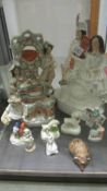 Two large Staffordshire flat backs, smaller examples and a quantity of assorted figures, some a/f.