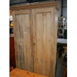 An antique pine 2 door cupboard.