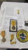 2 American Vietnam service medals together with a miniature service medal and a Zippo Vietnam