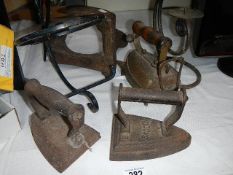 A mixed lot of old irons, candle holder etc.
