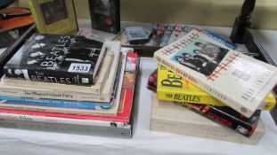 A collection of Beatles ephemera including cassette tapes. books etc.