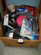 A box of assorted gadgets including radio, binoculars, camera etc.