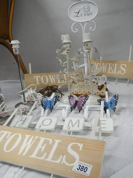 A mixed lot of bathroom and other items including towel holders, toilet roll holder, lamp bases etc.