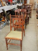 Eight antique chairs.