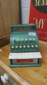 A Merit toy cash register.