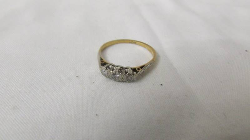 An 18ct gold ring set (2.3 grams) and an 18ct gold diamond solitaire ring (2.5 grams). - Image 2 of 3