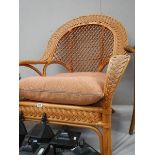 A good conservatory fan back chair with matching foot stool.