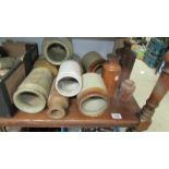 A box of stoneware bottles and jars.