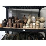 A shelf of brown/white stoneware