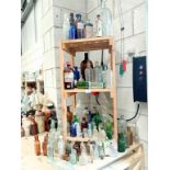 3 shelves of decorative bottles,