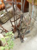 Three old wall mounting saddle stands.