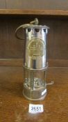 An original Eccles brass miners M & O safety lamp by The Protector Lamp & Lighting Co., Ltd.