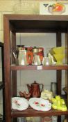 Six shelves of kitchen water including jelly moulds, Pyrex, Tupperware etc.