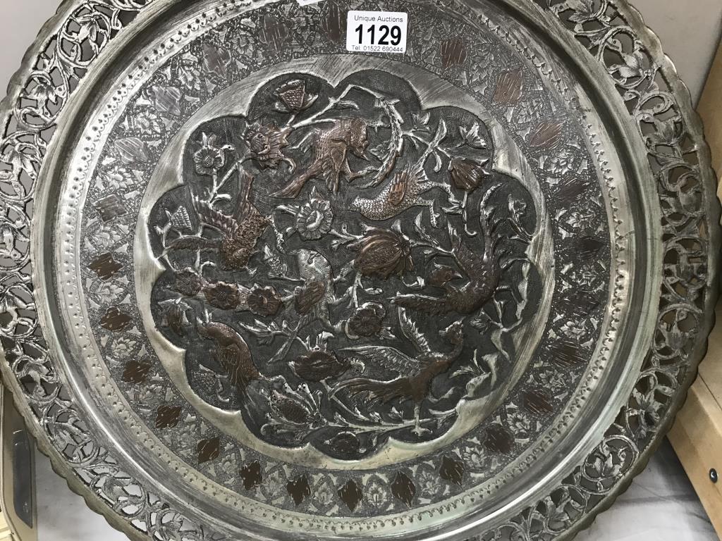 A large round Indian copper tray with relief decoration & silver plated finish - Image 2 of 3