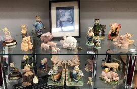 A good lot of pig figurines including picture in picture frame