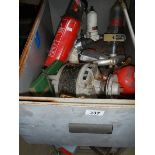 A box of wheels, electrical switches, motors etc.