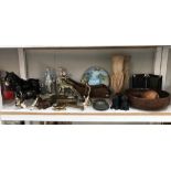 A large shelf of miscellaneous including brass,