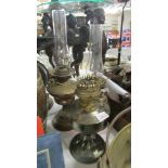 Three vintage oil lamps.