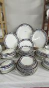 48 pieces (12 place settings) of Newport Pottery, Burslem dinnerware including graduated platters,