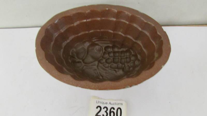 A 19th century brown stoneware jelly moulds of a bunch of grapes. - Image 2 of 2
