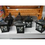 A quantity of plastic wall lanterns.