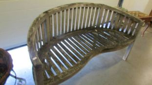 A curved garden bench.