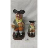 A Royal Doulton traditional Toby Jug Happy John, 8321 and a smaller example.