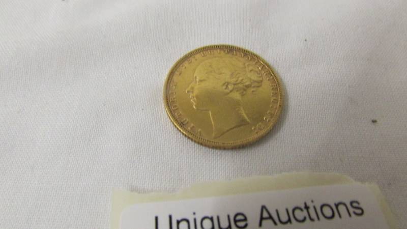 An 1873 gold sovereign.