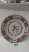 An early Chinese floral decorated plate, 23 cm diameter, chips to back rim.