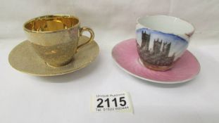 A Lincoln Cathedral souvenir tea cup and saucer together with a Jersey pottery tea cup and saucer.