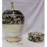 A Wedgwood 'Cornucopia' pattern lidded urn and a matching lidded pot.