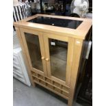 A beech kitchen cupboard with marble top,