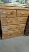 A 2 over 3 pine chest of drawers.