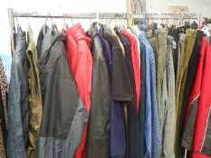 A full rail of vintage and other clothing.