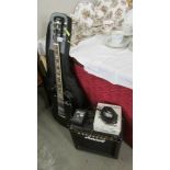 An electric guitar with Marshall amplifier and accessories. In working order.