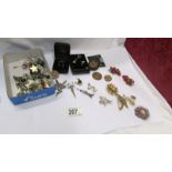A mixed lot of earrings (pairs and odds) and a quantity of brooches.