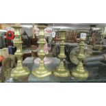 Two pairs of Victorian brass candlesticks.